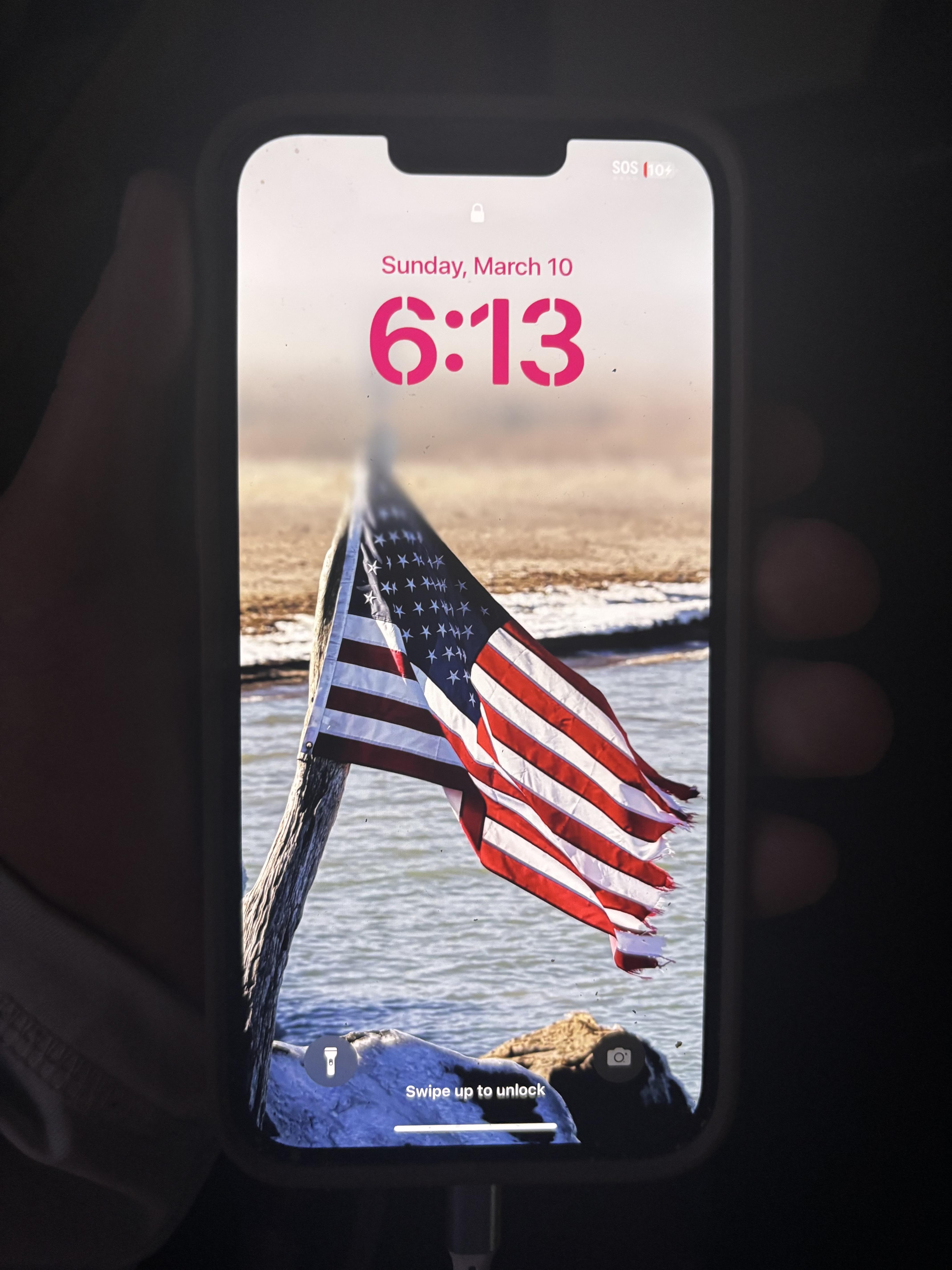 A cell phone with a flag on it