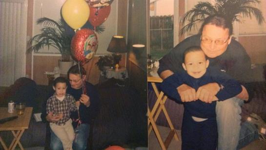 A father holds balloons while his son smiles in a warm living room filled with family.