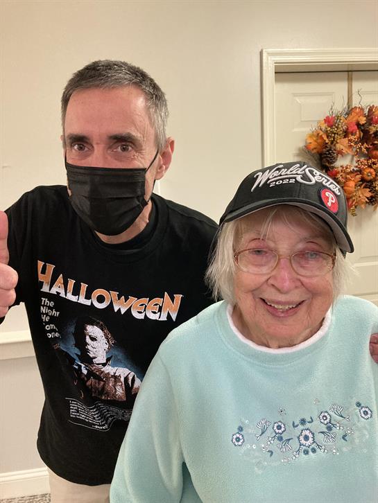 A man and woman wearing face masks