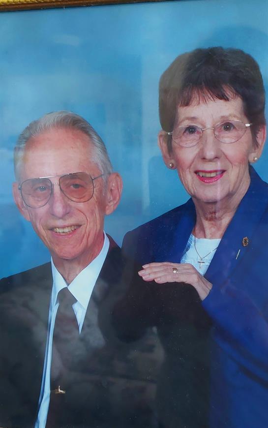 A man and woman posing for a picture