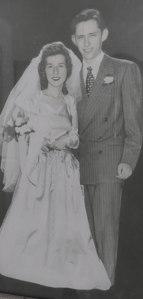 A man and woman in wedding attire