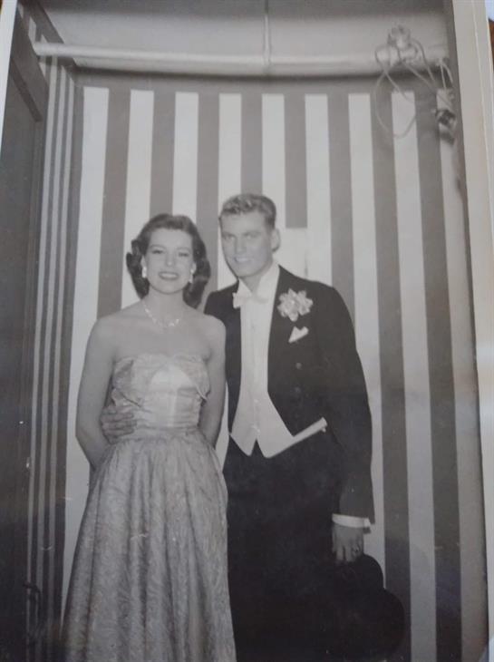 A man and woman posing for a picture