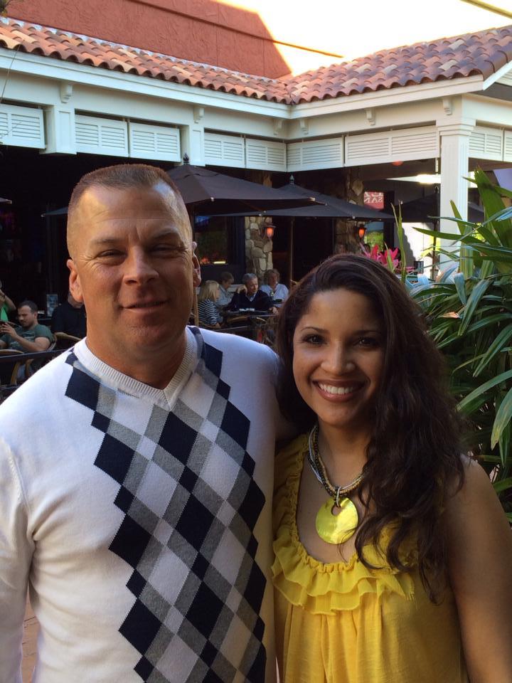 A man and woman posing for a picture