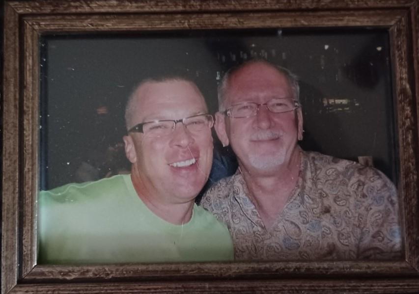 A couple of men in a frame