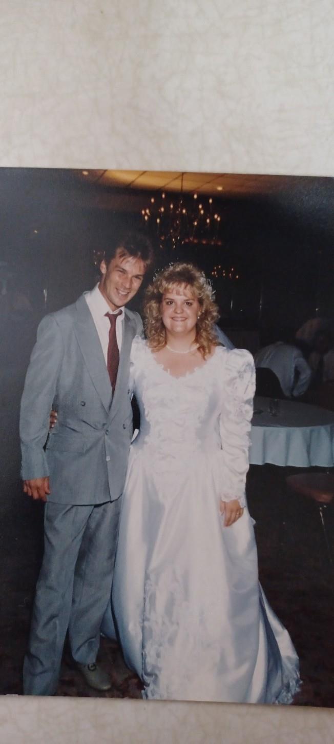 A man and woman posing for a picture