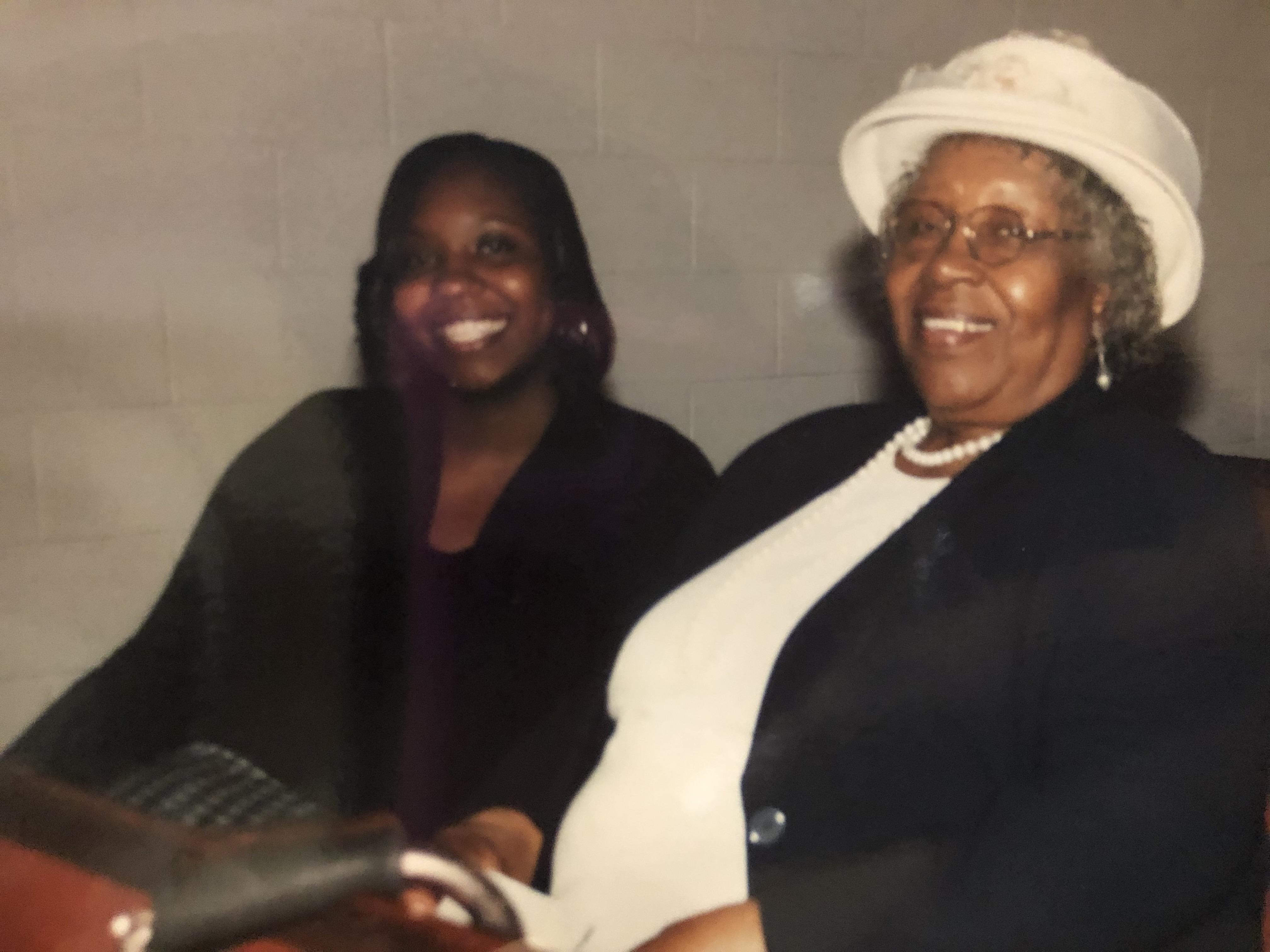 A woman sitting next to a woman