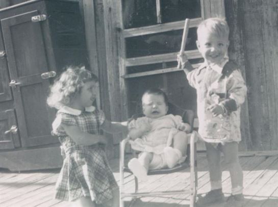A group of children standing outside