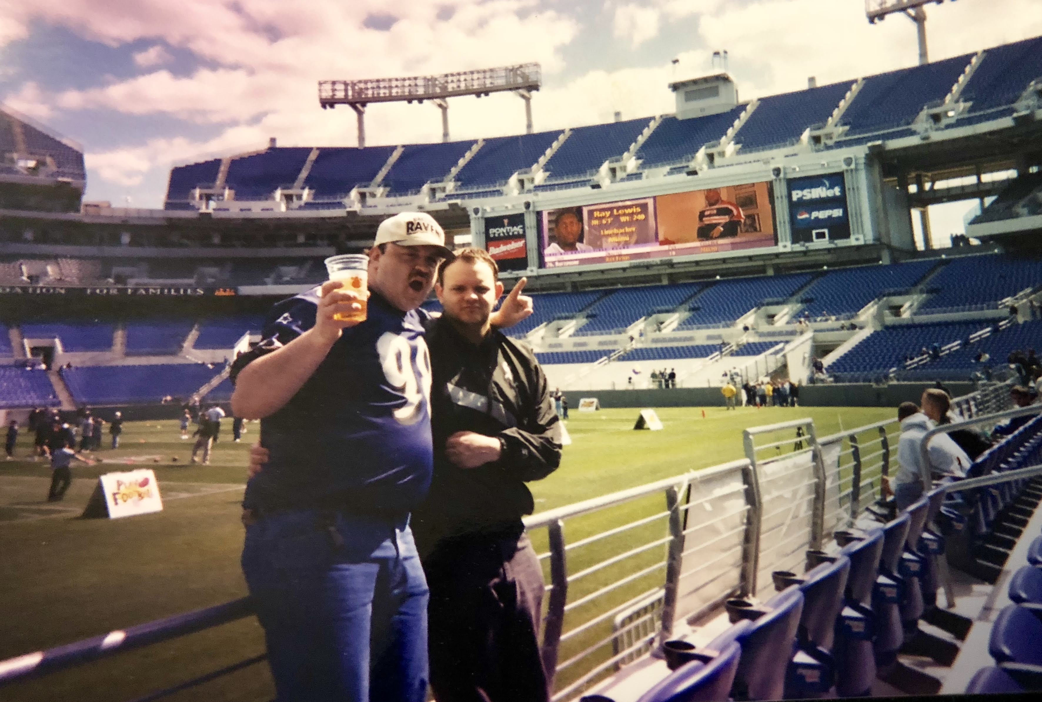 Two men standing in a stadium
