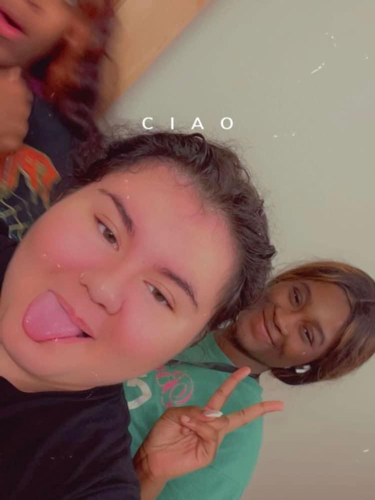 Group of friends are posing playfully, showcasing joy and friendship in a lively atmosphere.