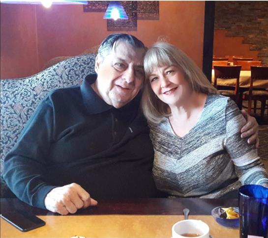 A man and woman sitting at a table