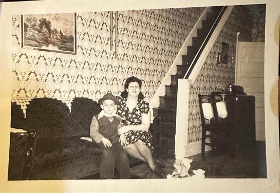 A woman and a boy sitting on a couch