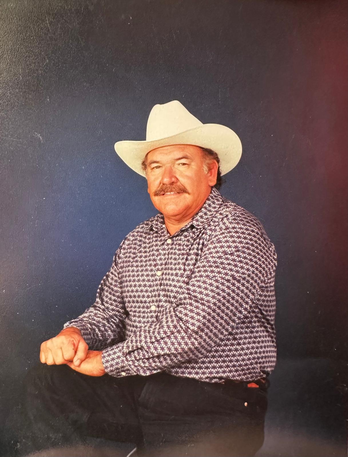 A man in a cowboy hat