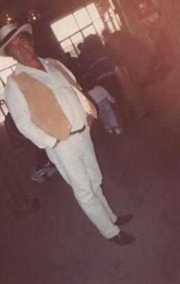 A man in a white suit