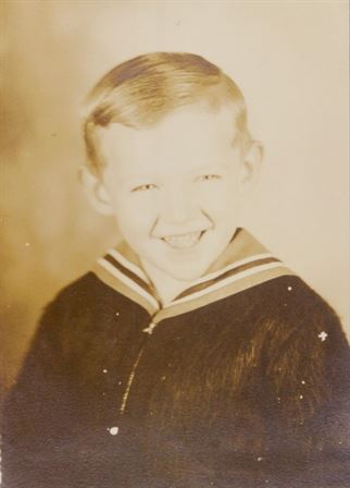 A boy smiling for a picture