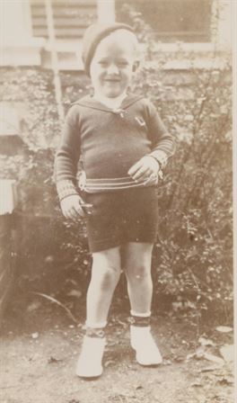 A child standing in a yard