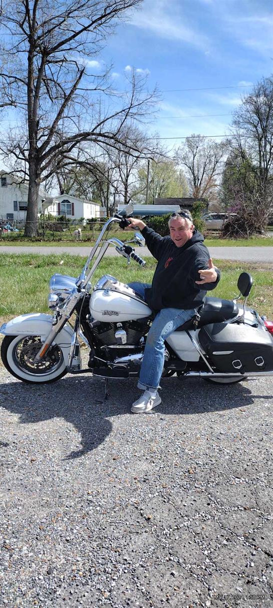 A man sitting on a motorcycle