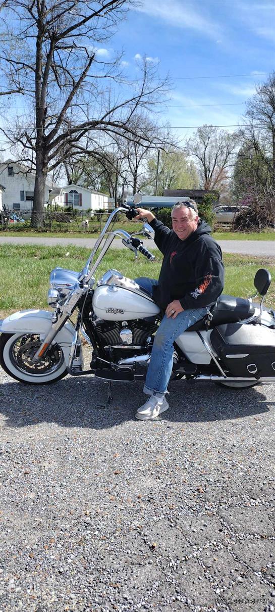 A man sitting on a motorcycle