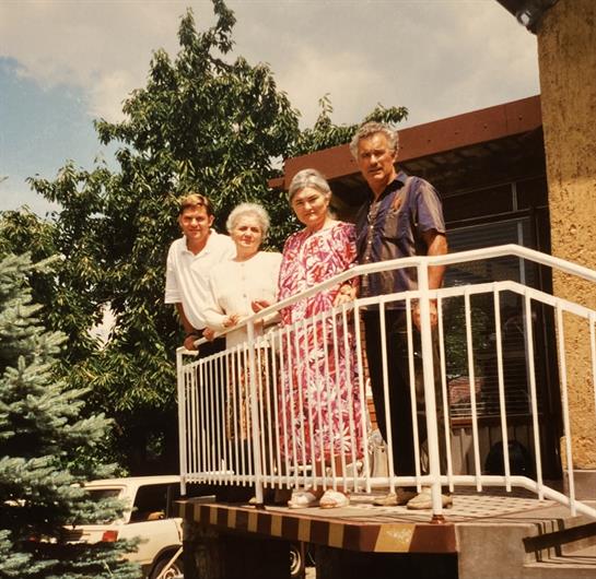 A group of people standing on a porch