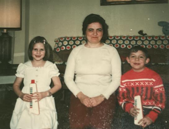 A woman and children posing for a picture