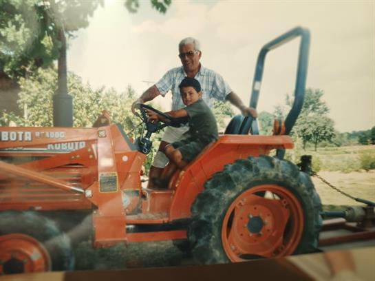A man and boy on a tractor