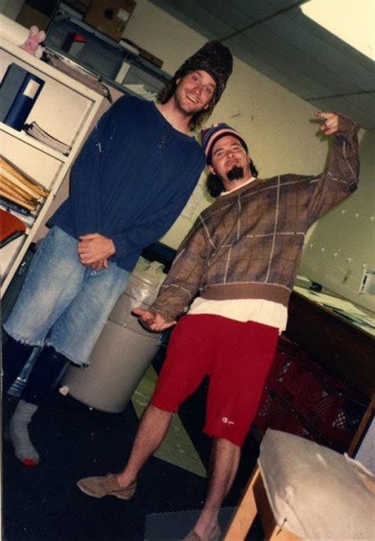 A couple of men posing for a picture