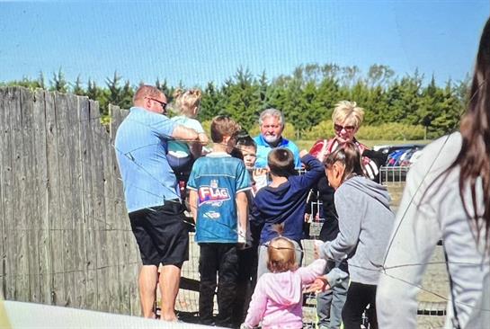 A group of people standing around
