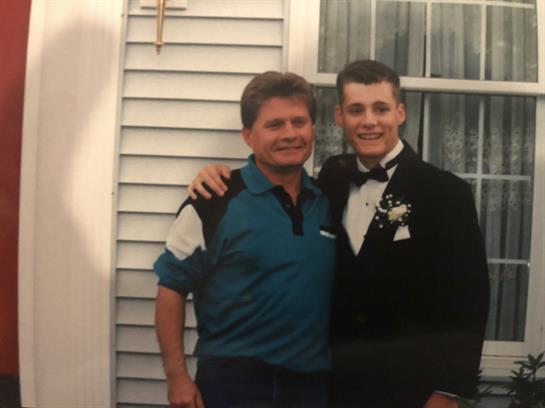 A couple of men posing for a picture