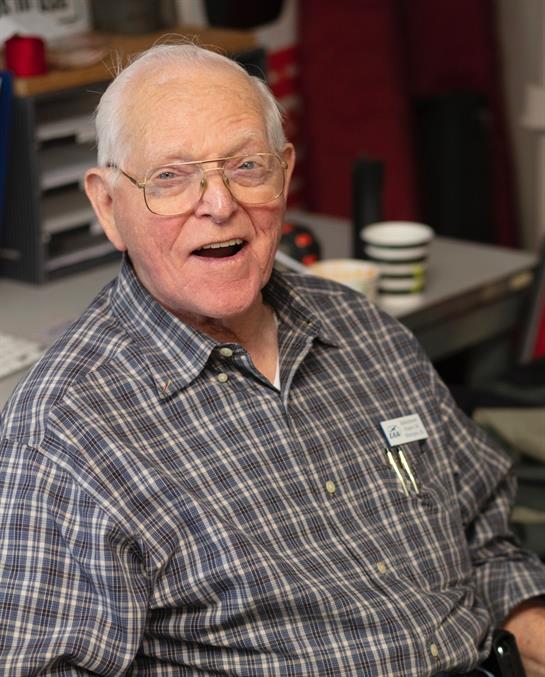An old man wearing glasses