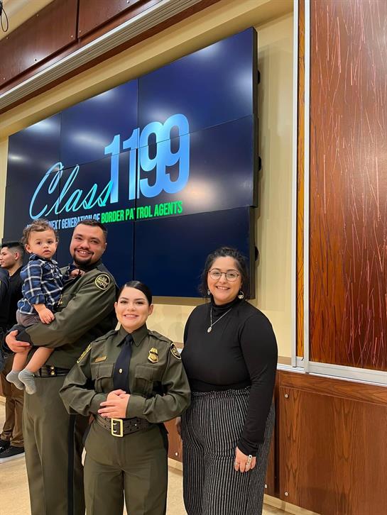 A proud family gathers to celebrate the graduation of Border Patrol agents at a formal event.