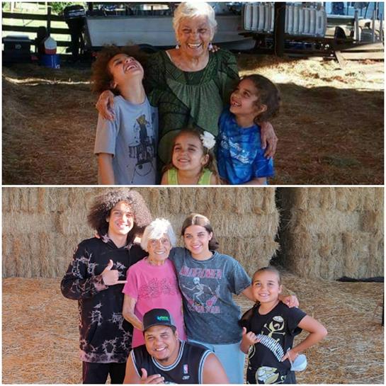 A joyful family enjoys time together in a farm setting with smiles and laughter.