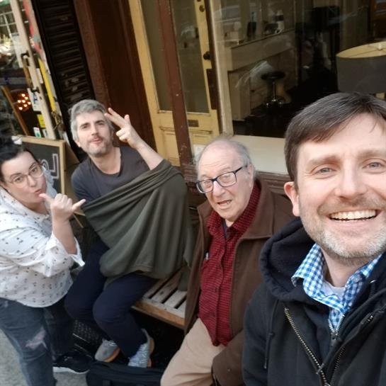 A group of men sitting on a bench