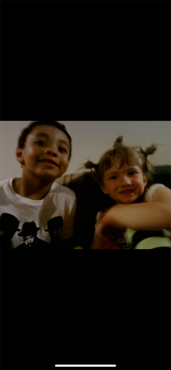 A boy and girl smiling
