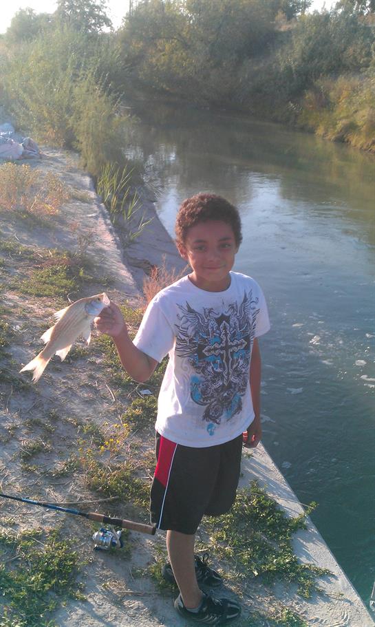A boy holding a fish