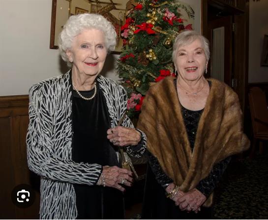 Two women standing next to each other