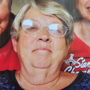 Close-knit group enjoys quality time, sharing smiles and laughter in a relaxed home setting.