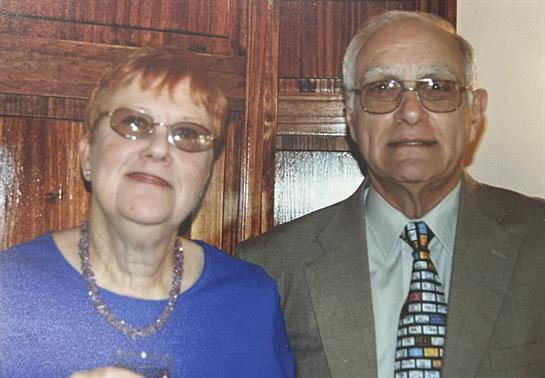 A man and woman posing for a picture