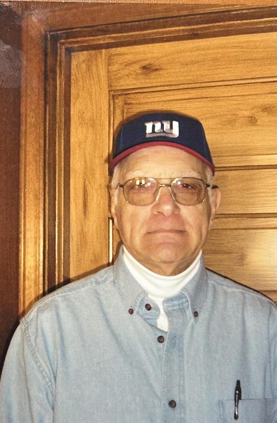 A man wearing a hat and glasses