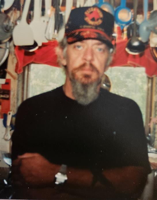 A man with a beard wearing a hat