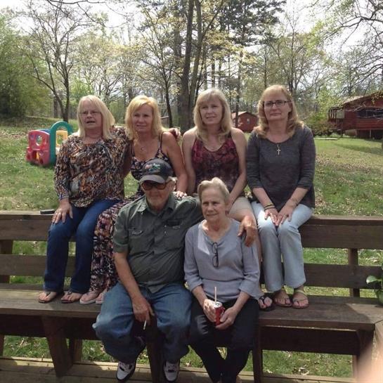 A group of people sitting on a bench