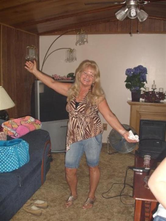 A woman holding a glass