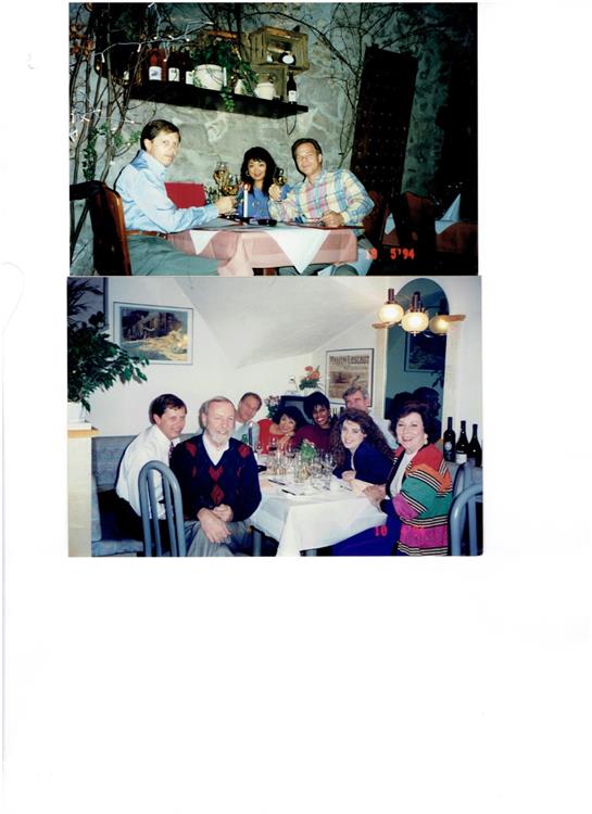 Friends gather at a restaurant, sharing stories and enjoying a meal in a warm atmosphere.