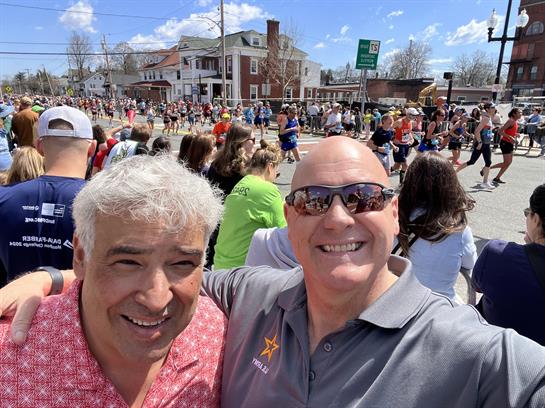 A vibrant community celebrates with cheerful participants running in a local race event.