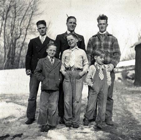 A group of men standing together in the snow