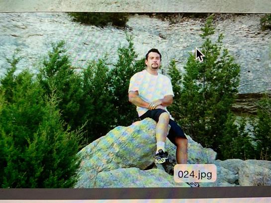 A man sitting on a rock