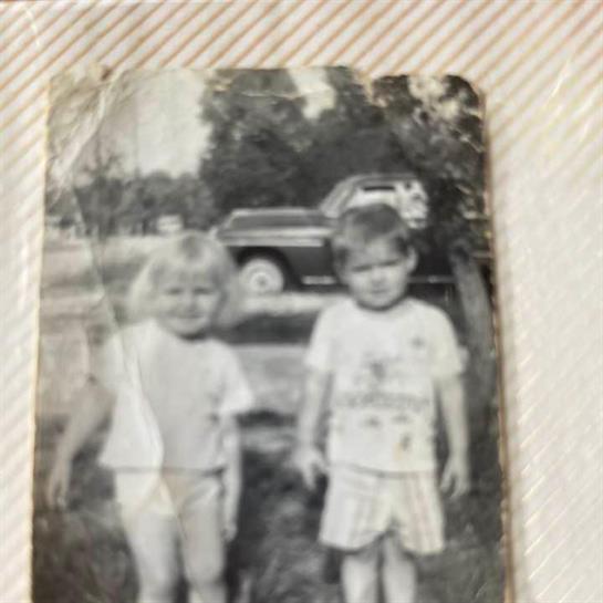 A black and white photo of two children