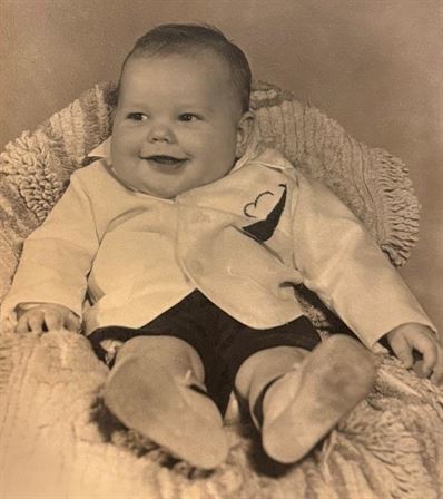 A baby lying on a blanket