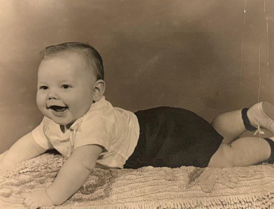 A baby lying on its stomach