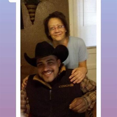 A man and woman posing for a picture