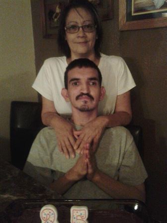 A woman sitting on a man's lap