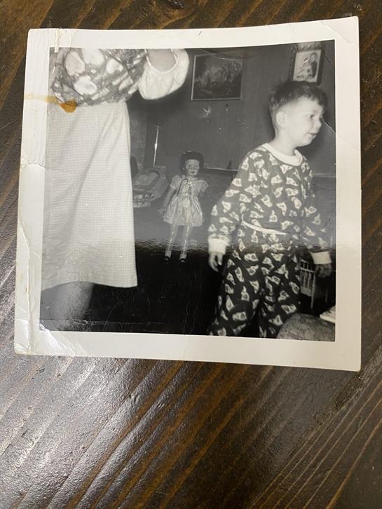 A black and white photo of a woman and a boy